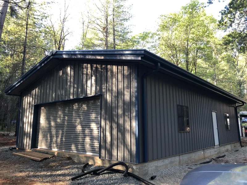 Steel workshop in a wooded setting